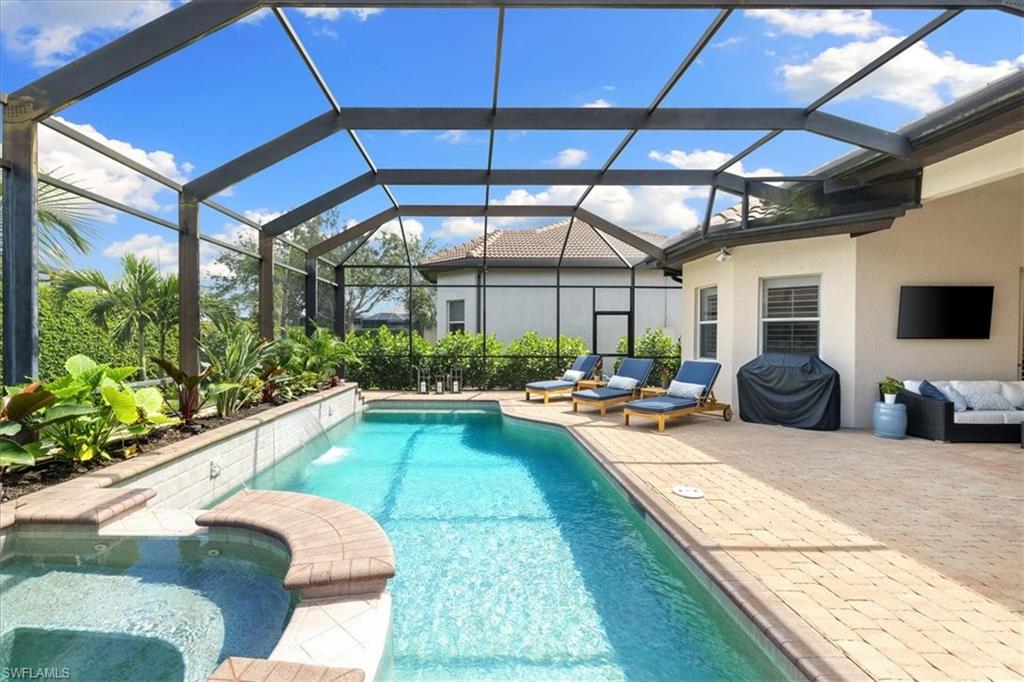a view of swimming pool with outdoor seating