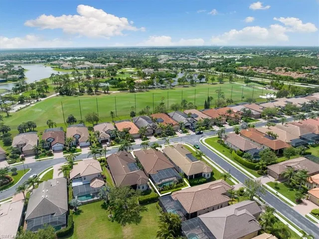 an aerial view of a houses with a lake view