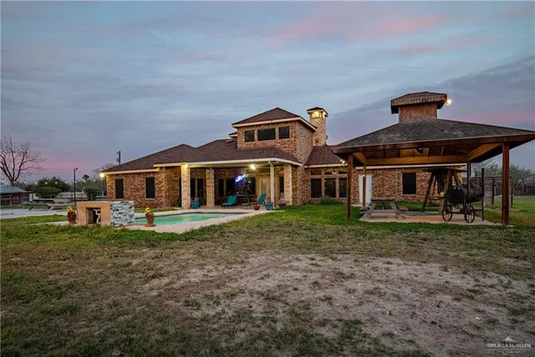 a front view of house with outdoor space and garden