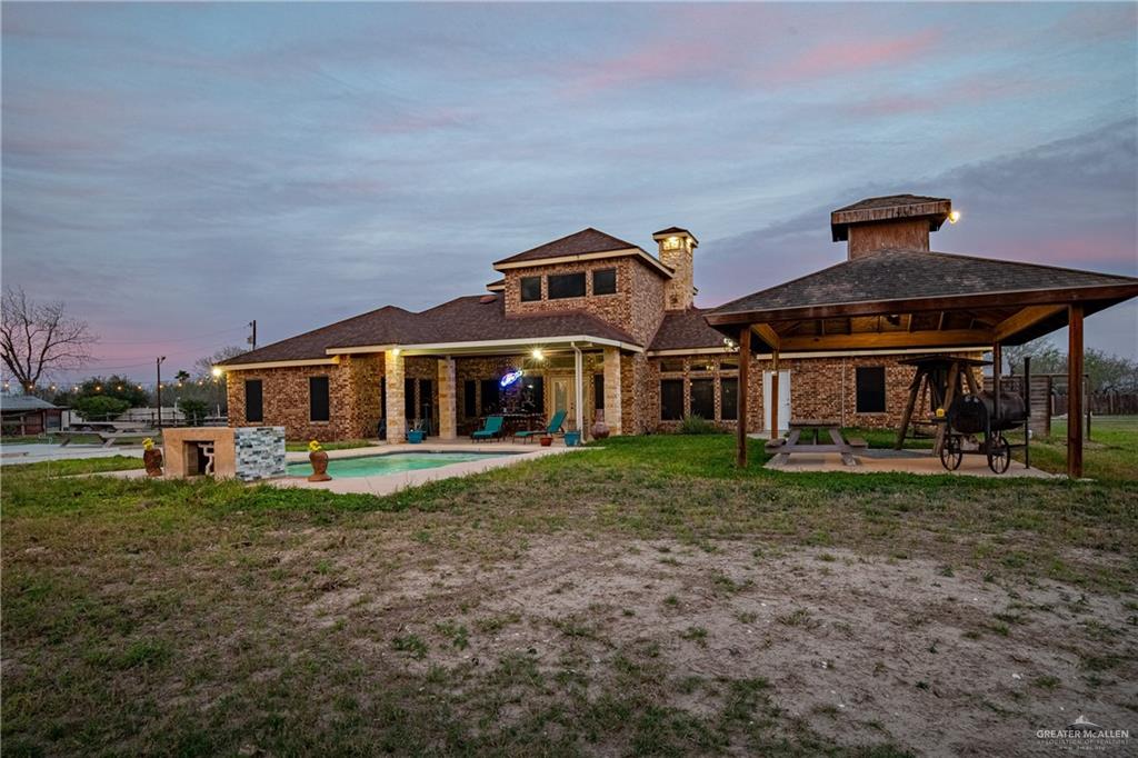 5048 Mile 8 Road Edinburg, TX 78541 - Photo 16 of 33 a front view of house with outdoor space and garden