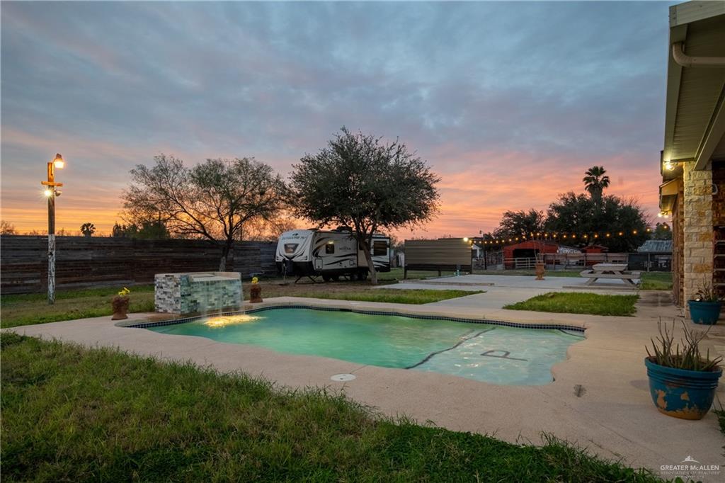 5048 Mile 8 Road Edinburg, TX 78541 - Photo 17 of 33 a view of a garden with swimming pool