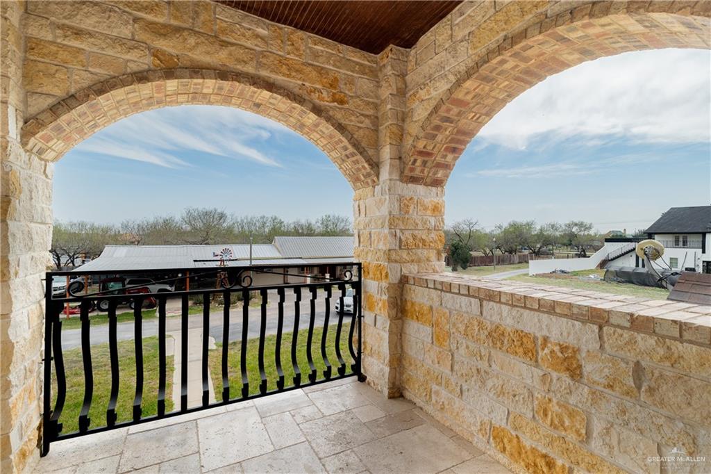 5048 Mile 8 Road Edinburg, TX 78541 - Photo 18 of 33 a balcony with view of trees in front