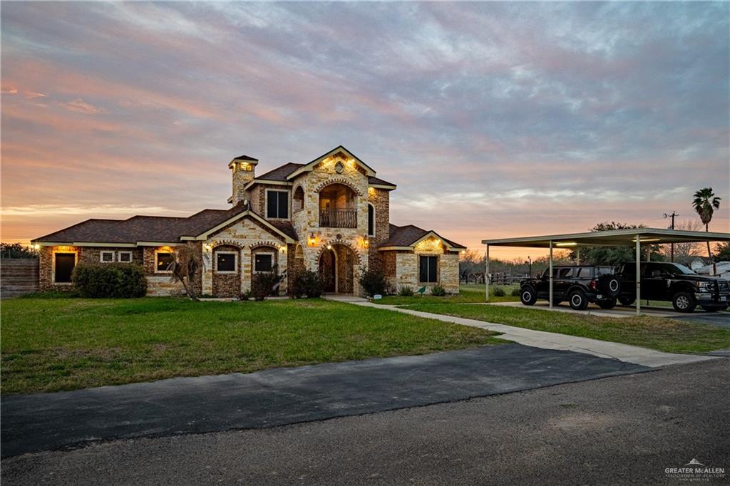5048 Mile 8 Road Edinburg, TX 78541 - Photo 2 of 33 a front view of a house with a yard