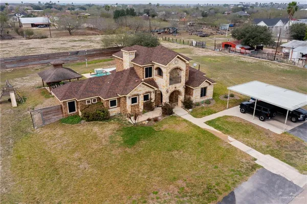 an aerial view of a house with swimming pool