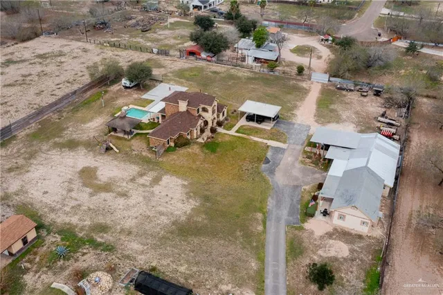 an aerial view of a house with swimming pool