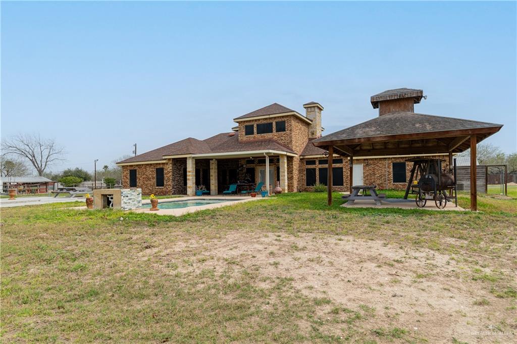 5048 Mile 8 Road Edinburg, TX 78541 - Photo 32 of 33 a front view of a house with a yard