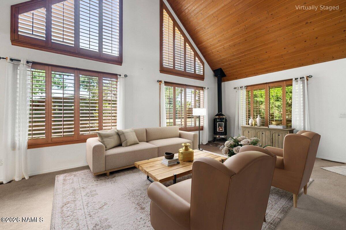 5535 East Western Star Road Flagstaff, AZ 86004 - Photo 5 of 49 a living room with furniture and large windows
