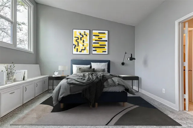 a view of a garden with plants and large trees