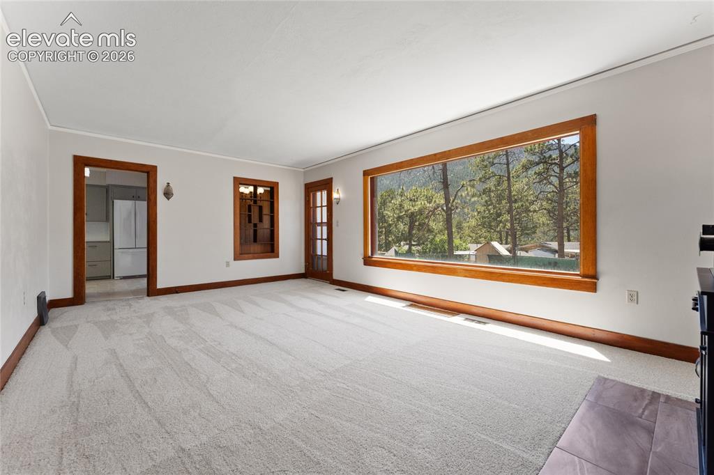 7755 Topeka Avenue Cascade, CO 80809 - Photo 6 of 38 Huge double pane picture window