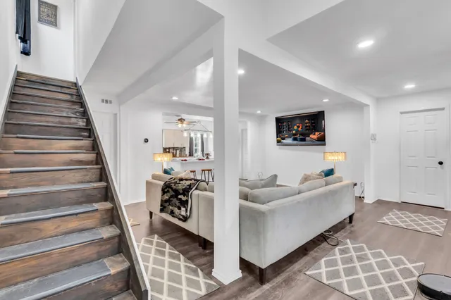 a living room with furniture and a rug