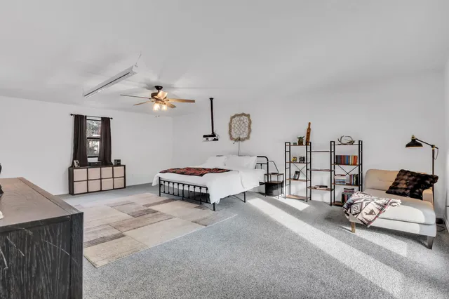 a bedroom with furniture and a couch