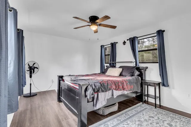 a bed room with a bed and a chandelier