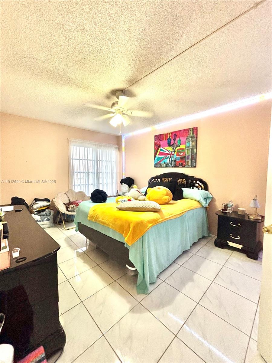 4160 Inverrary Drive, Unit 204 Lauderhill, FL 33319 - Photo 8 of 9 a spacious bathroom with a tub and a shower