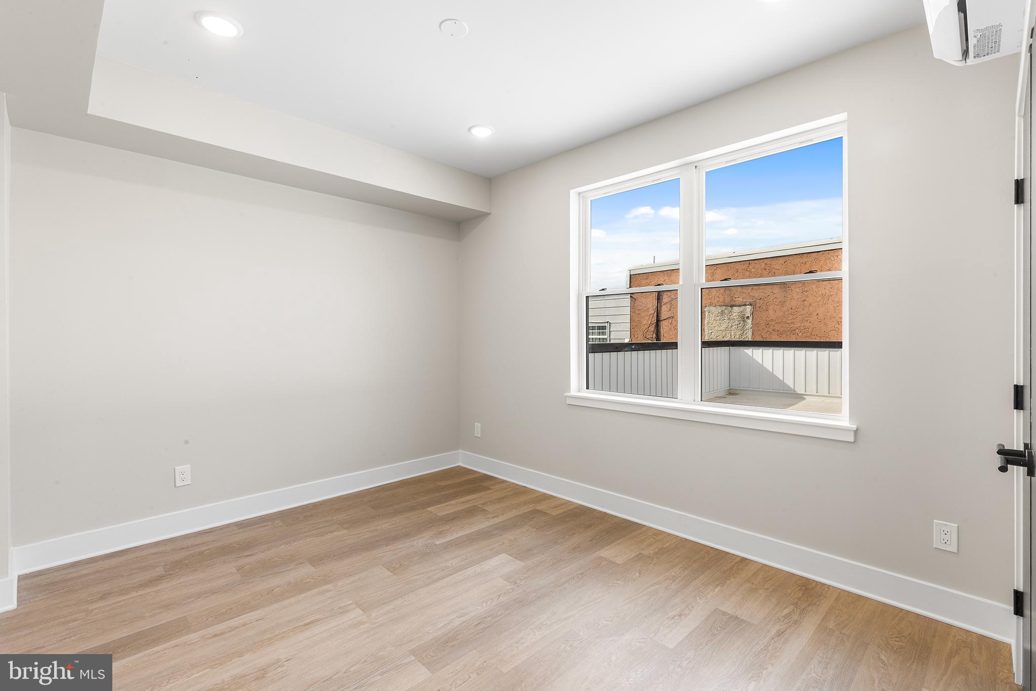 1903 Jackson Street, Unit 1 Philadelphia, PA 19145 - Photo 12 of 17 an empty room with a window