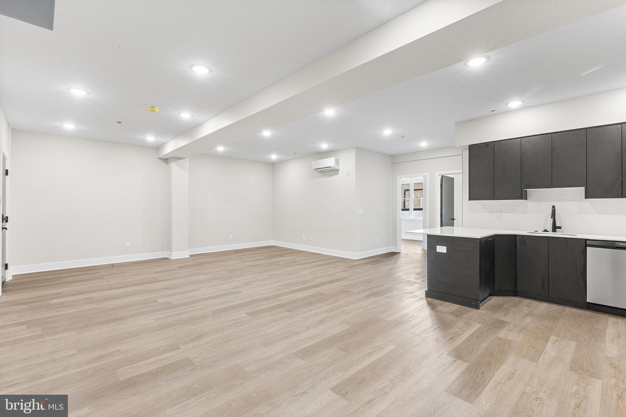 1903 Jackson Street, Unit 1 Philadelphia, PA 19145 - Photo 4 of 17 a view of kitchen with kitchen island microwave and sink