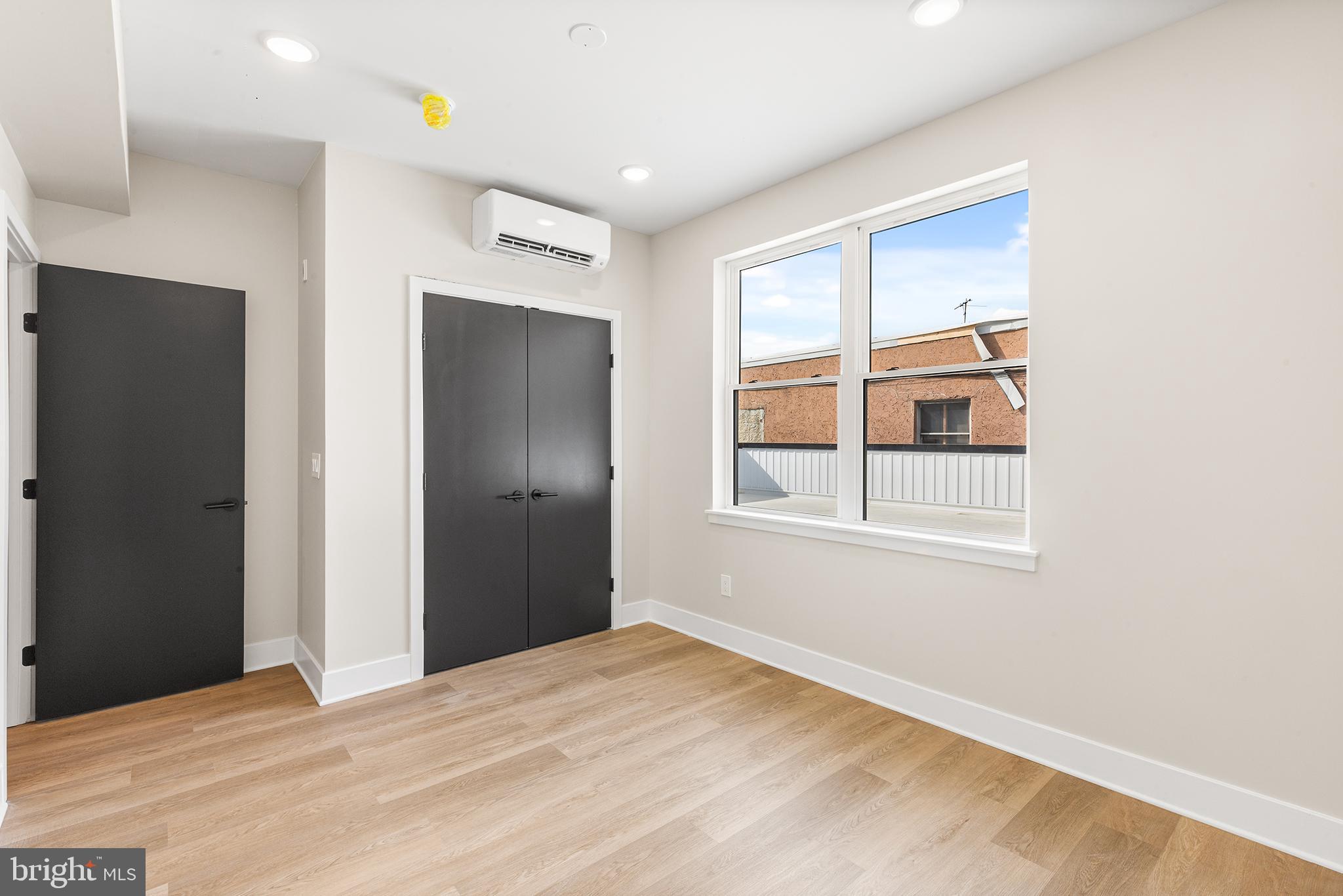 1903 Jackson Street, Unit 1 Philadelphia, PA 19145 - Photo 9 of 17 a bedroom with a bed and a window