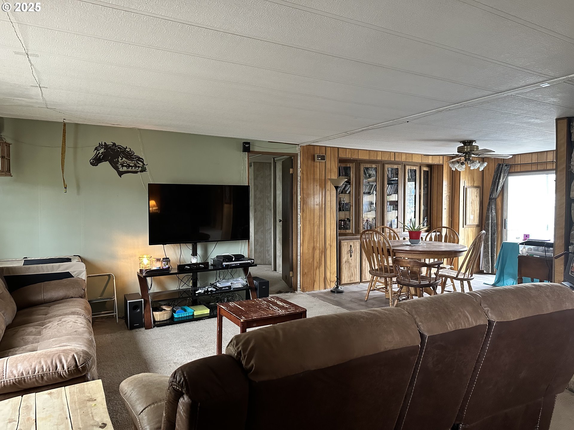 1015 C Street Fossil, OR 97830 - Photo 17 of 33 a living room with furniture and a flat screen tv