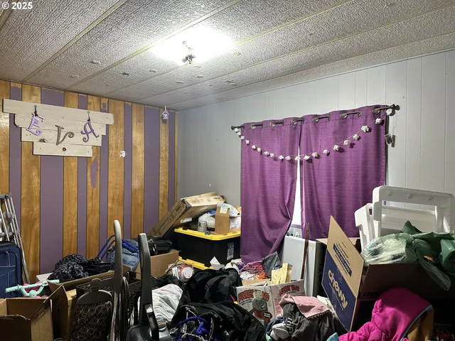 a bedroom with furniture and a closet