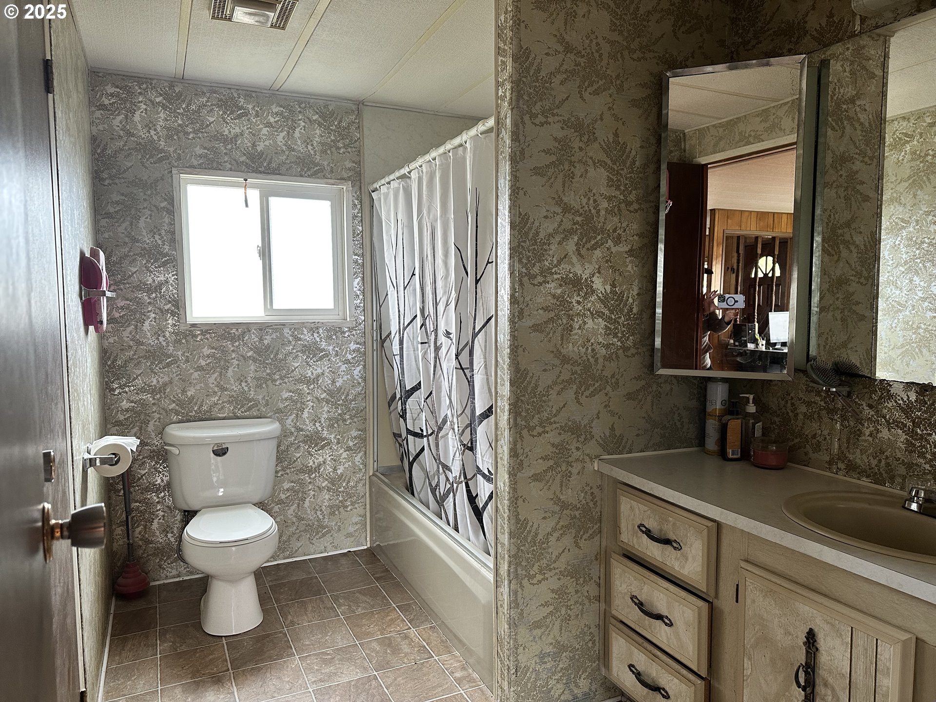 1015 C Street Fossil, OR 97830 - Photo 22 of 33 a bathroom with a toilet sink and mirror