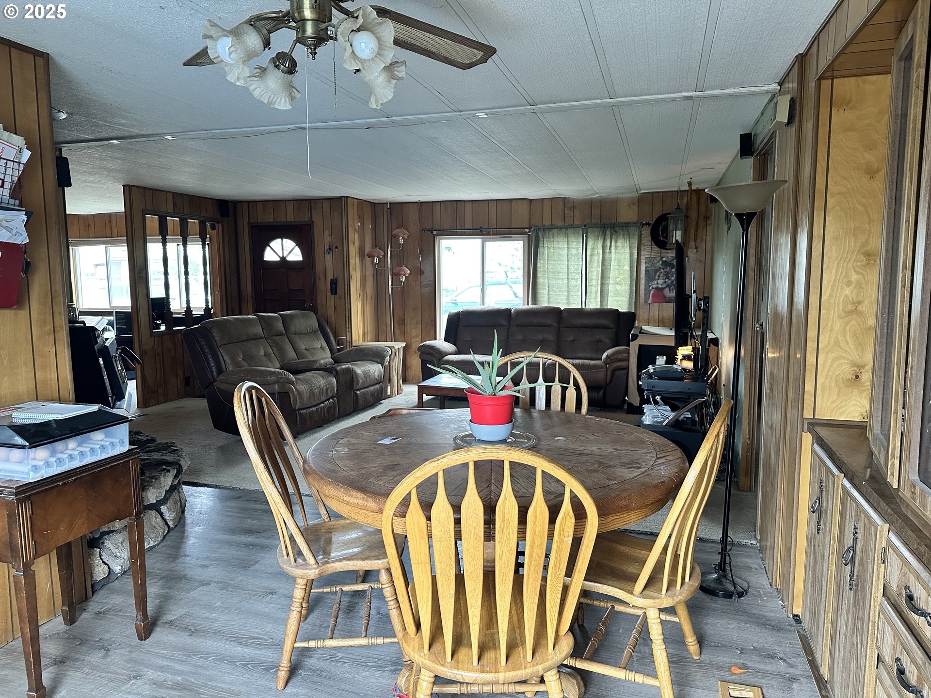 1015 C Street Fossil, OR 97830 - Photo 24 of 33 a dining room with furniture a window and wooden floor