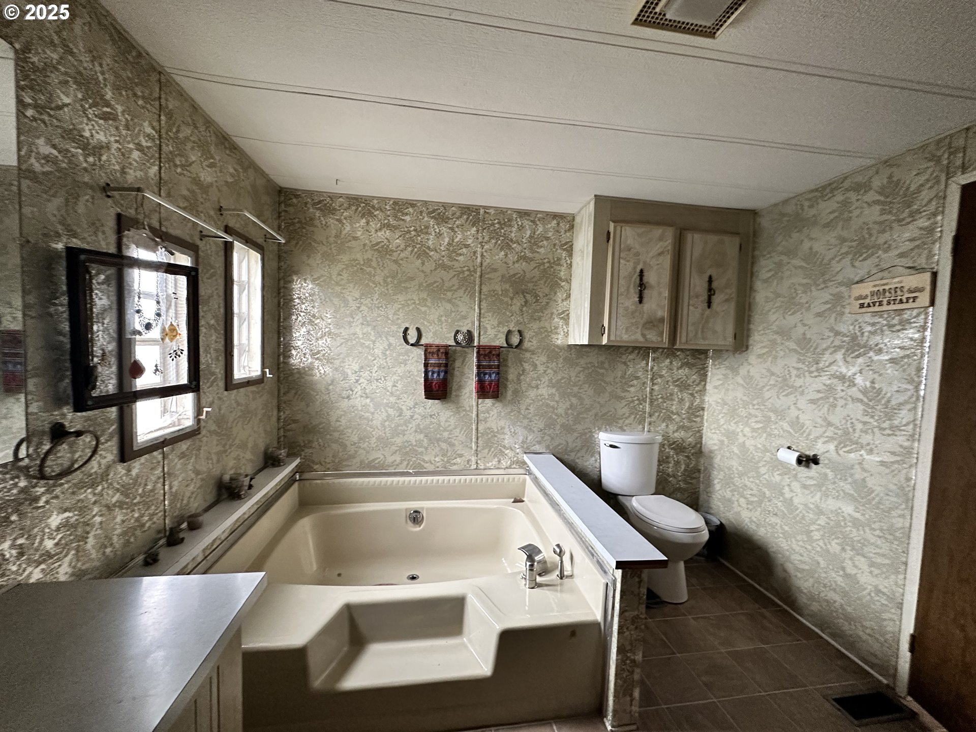 1015 C Street Fossil, OR 97830 - Photo 30 of 33 a bathroom with a sink a toilet and bathtub