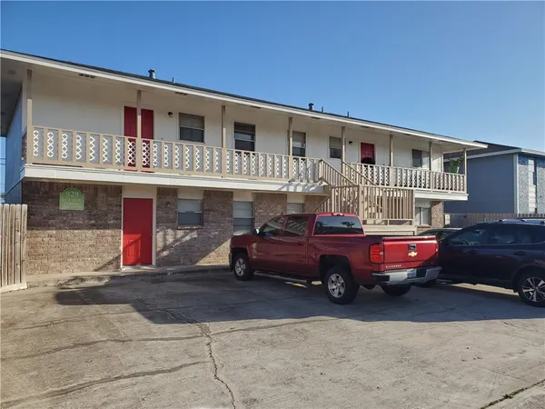 a front view of a house with parking space