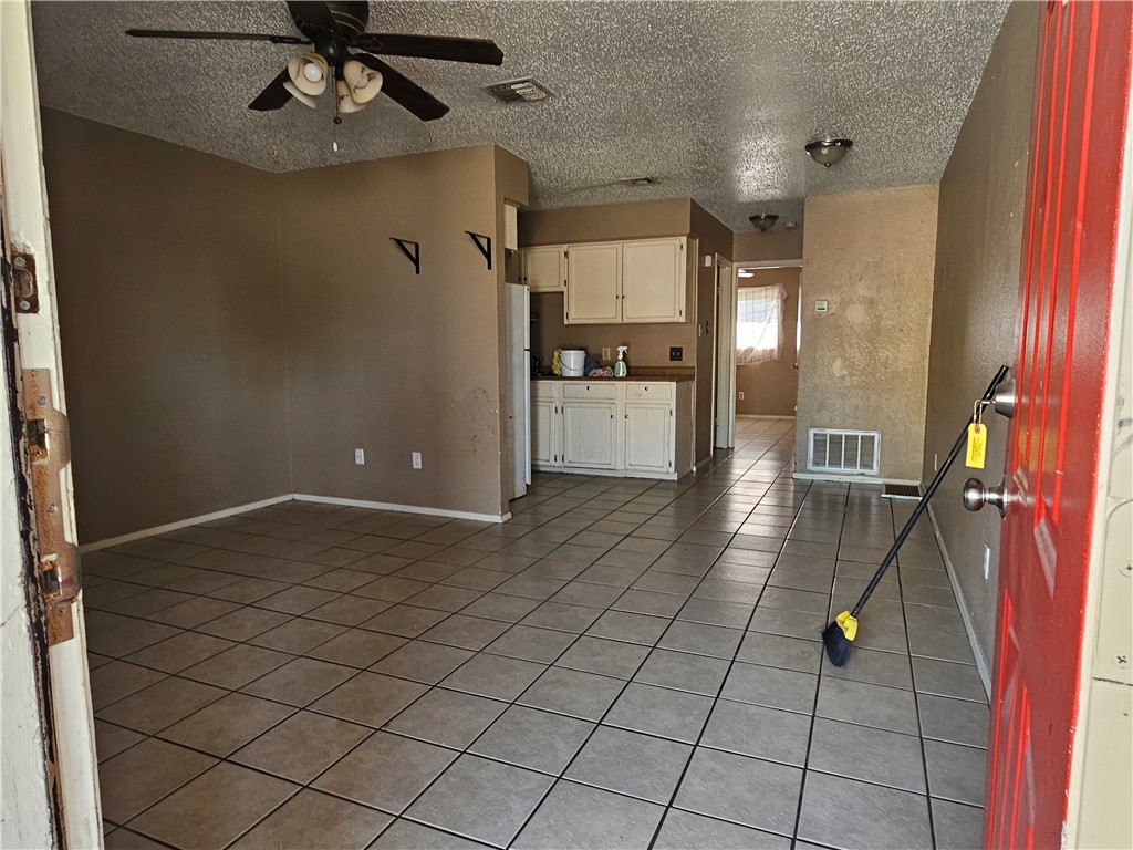 929 Quetzal Street, Unit 3 Corpus Christi, TX 78418 - Photo 2 of 4 a kitchen with stainless steel appliances granite countertop a refrigerator and a stove top oven