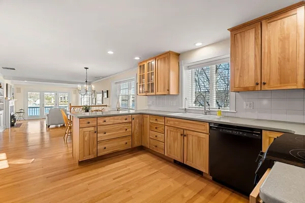 a kitchen with stainless steel appliances granite countertop a stove a sink and a granite countertops with cabinets