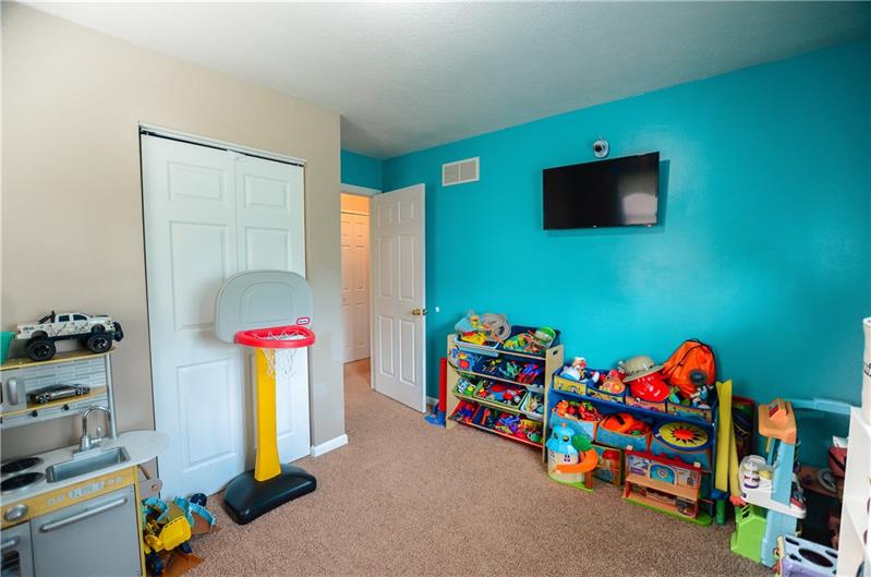 2090 Marshall Road Monaca, PA 15061 - Photo 15 of 24 Talk about versatility! The "family room" is currently being used as a playroom, but could easily work as a 4th bedroom. Like all other bedrooms, there is ample closet space available.