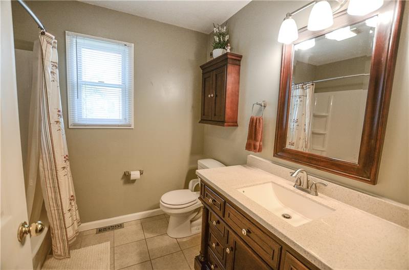 2090 Marshall Road Monaca, PA 15061 - Photo 18 of 24 Newly renovated bathroom features neutral paint color and tile, gorgeous new vanity with lighting, and a fabulous new bathtub!