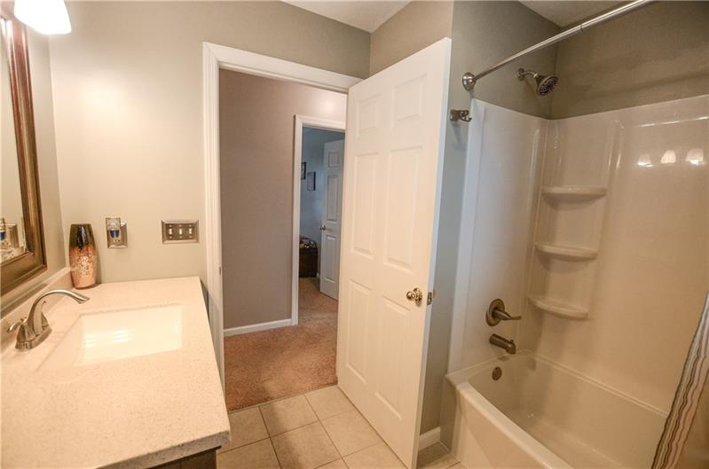 2090 Marshall Road Monaca, PA 15061 - Photo 19 of 24 Newly renovated bathroom features neutral paint color and tile, gorgeous new vanity with lighting, and a fabulous new bathtub!