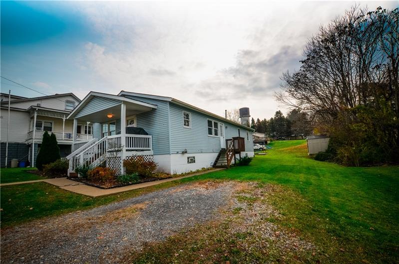 2090 Marshall Road Monaca, PA 15061 - Photo 3 of 24 Easy off-street parking available at this home, with a concrete walkway providing access to both the front and side porches.