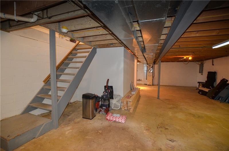 2090 Marshall Road Monaca, PA 15061 - Photo 21 of 24 Absolutely HUGE basement runs the length of the house and could easily accommodate a gaming area! Accessed by stairs from the kitchen/dining area, the conveniences abound in this house!