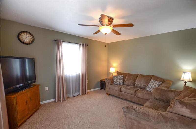 2090 Marshall Road Monaca, PA 15061 - Photo 5 of 24 Light and bright living room with wall-to-wall carpeting and ceiling fan.