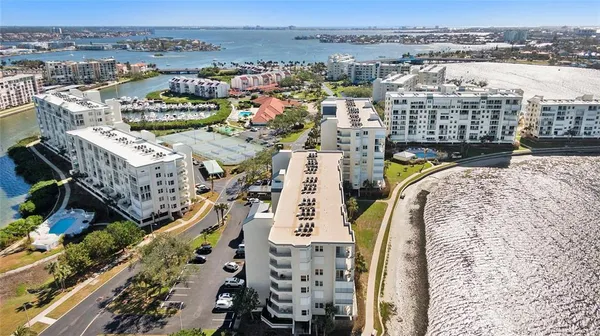 an aerial view of a house with a ocean view