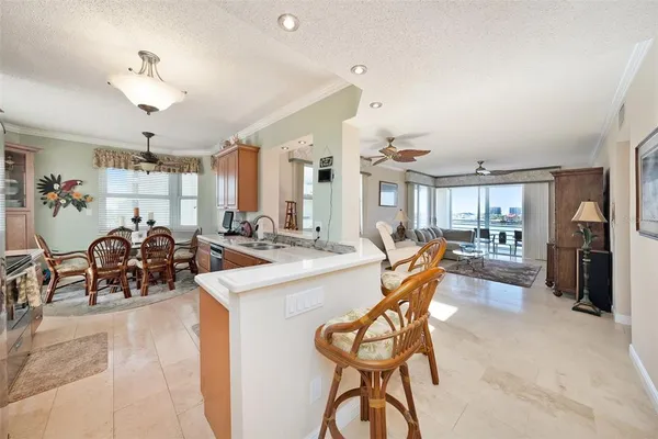 a very nice looking dining room with a large glass table and chairs