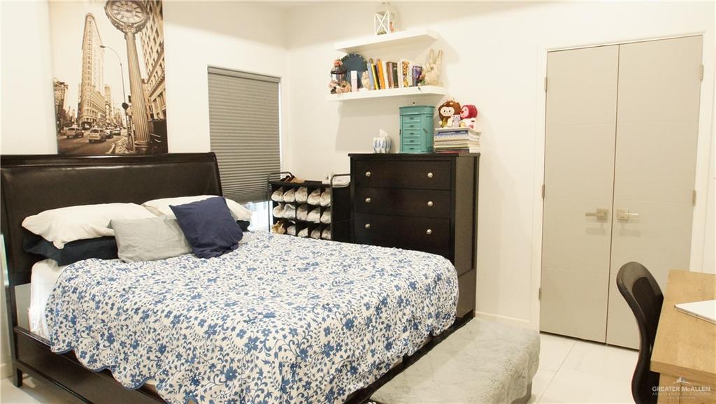 414 Ric Mar Street Edinburg, TX 78541 - Photo 29 of 36 Bedroom featuring white walls and tile flooring