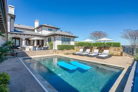 a front view of house with yard and outdoor seating
