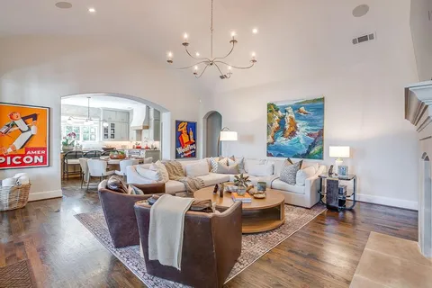 a living room with furniture fireplace and flat screen tv