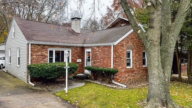 a view of a house with backyard porch and sitting area