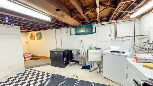 a bedroom with furniture and a wooden floor