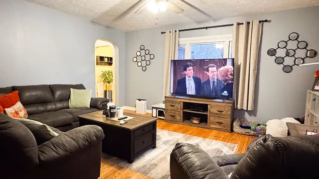a living room with furniture and a flat screen tv