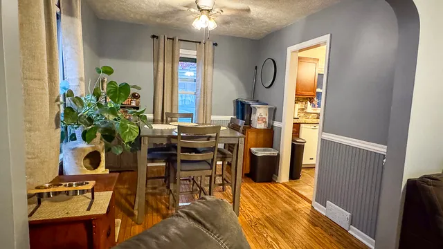 a workspace with furniture and a potted plant