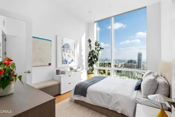 a bedroom with a bed and a couch