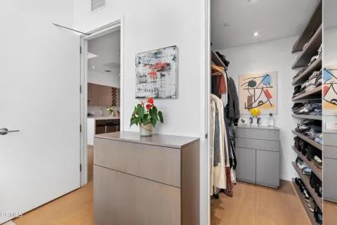 a room with cabinets and a refrigerator