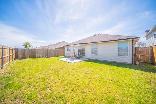 a house with swimming pool in front of it