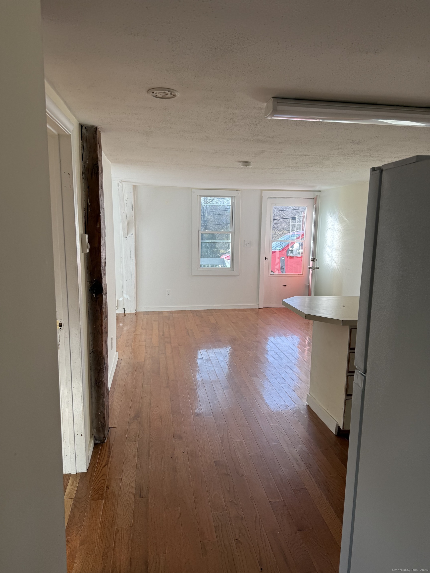2 Straits Turnpike Lane, Unit B Morris, CT 06763 - Photo 8 of 8 a view of livingroom with furniture and wooden floor