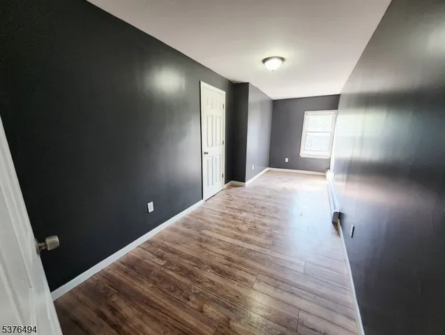 a view of a livingroom with wooden floor