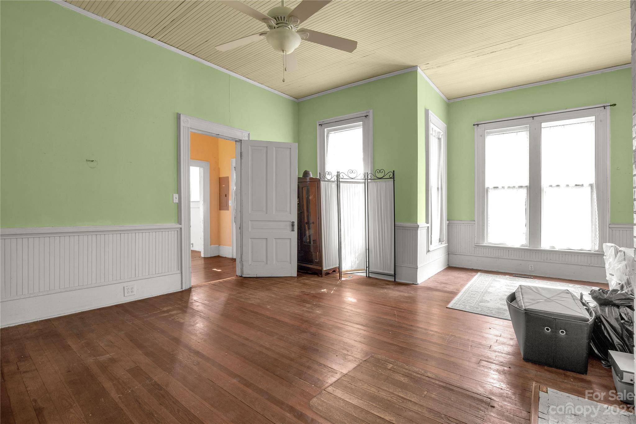 205 Walnut Street Chester, SC 29706 - Photo 16 of 32 a view of a livingroom with wooden floor and a window