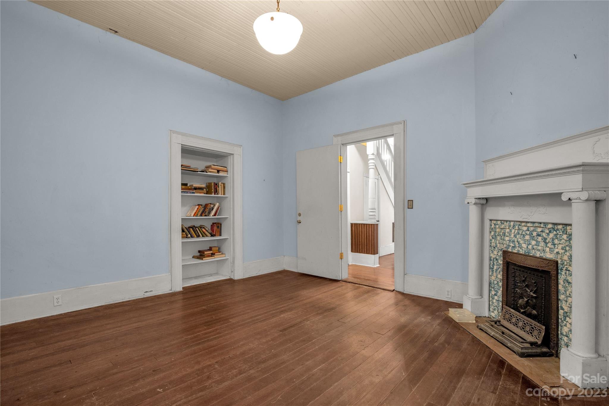 205 Walnut Street Chester, SC 29706 - Photo 19 of 32 an empty room with windows and fireplace